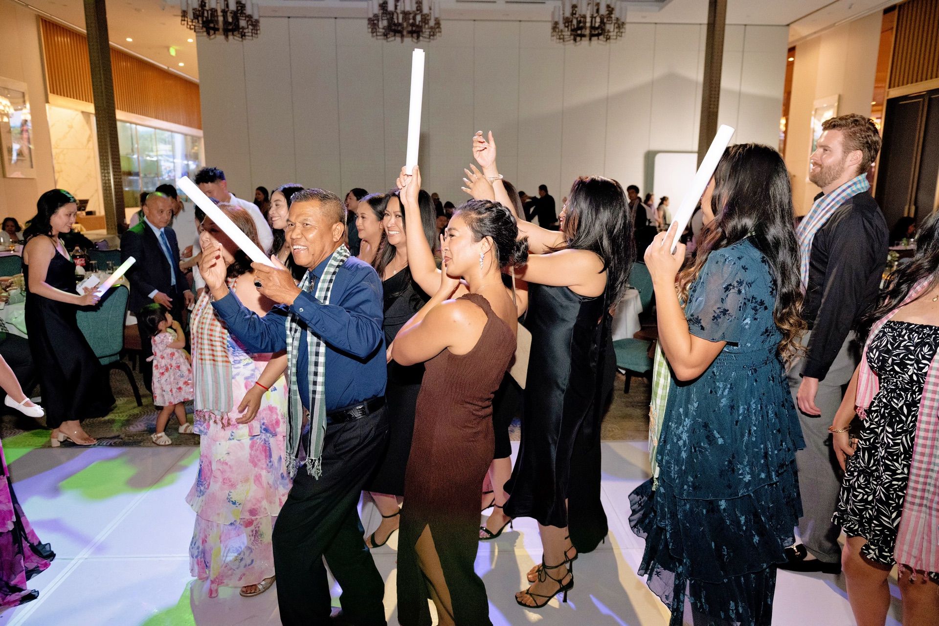 Wedding reception dance floor filling up