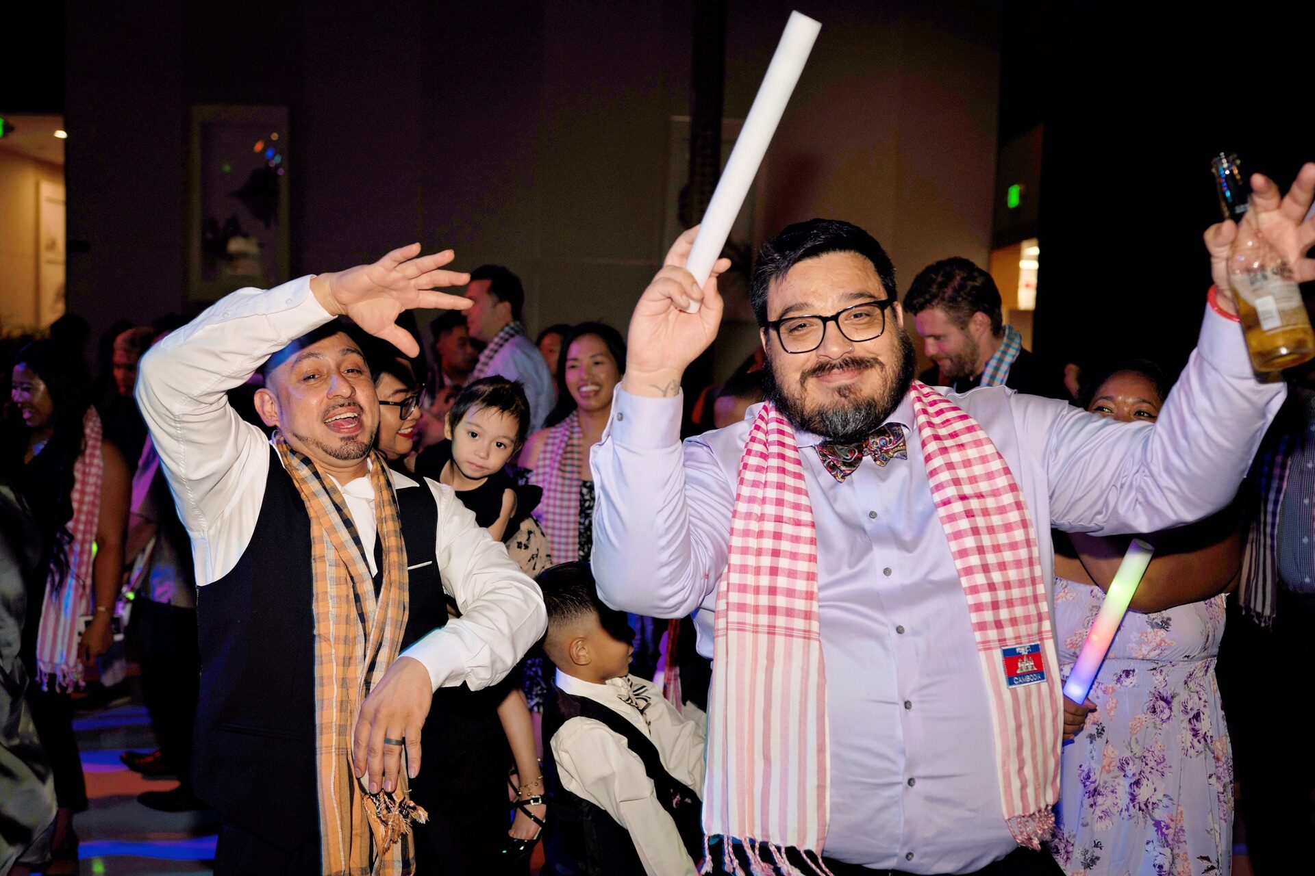 Groom dancing under dancefloor lights