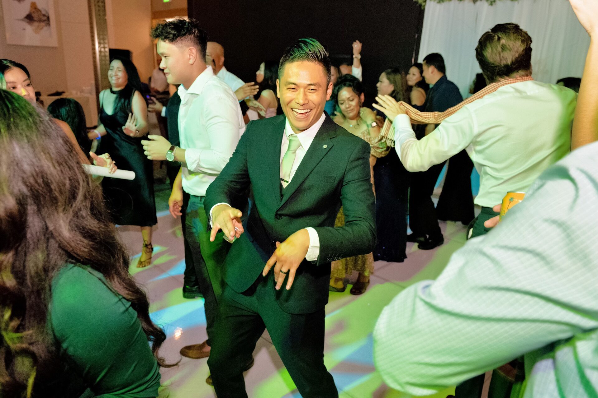 Wedding guests with foam glow sticks celebrating